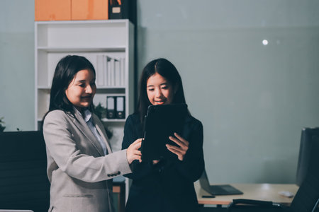 Accounting company provide finance and taxation planning for profitable cash flow, Auditor and accountant team working in office, analyze financial data and accounting record with calculator.Insightの写真素材