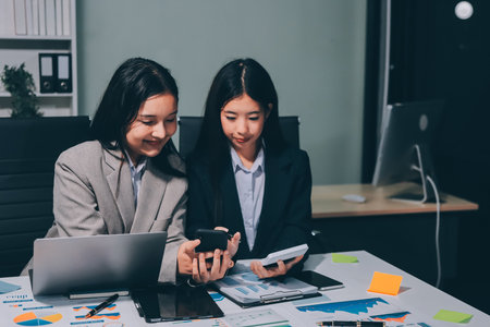 Accounting company provide finance and taxation planning for profitable cash flow, Auditor and accountant team working in office, analyze financial data and accounting record with calculator.Insightの写真素材