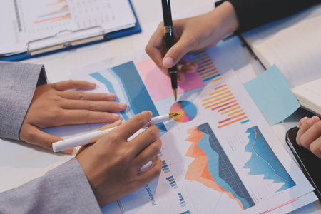 Team of business people working together in the meeting room office, teamwork background charts and graphs banner, double exposure successful teamwork,business planning concept.の写真素材