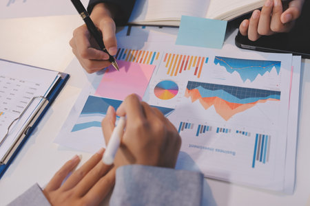 Team of business people working together in the meeting room office, teamwork background charts and graphs banner, double exposure successful teamwork,business planning concept.の写真素材