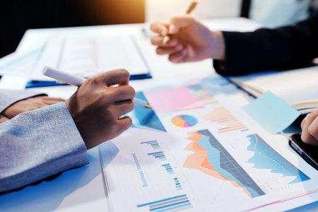 Team of business people working together in the meeting room office, teamwork background charts and graphs banner, double exposure successful teamwork,business planning concept.の写真素材