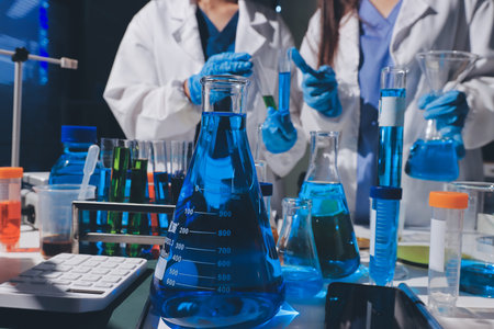 Scientist pipetting medical samples into microplate in laboratoryの写真素材