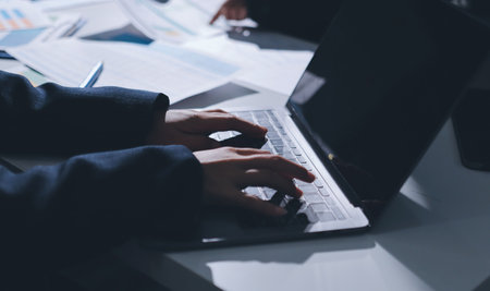 Group of business women working on a financial data expenses document.の写真素材