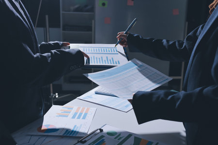 Group of business women working on a financial data expenses document.の写真素材