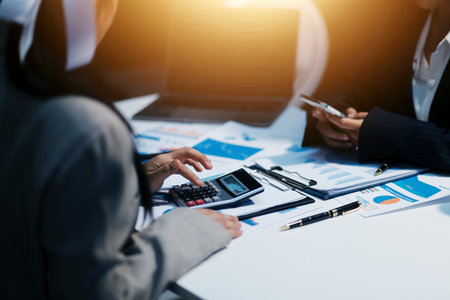 Close up of Business team analyzing income charts and graphs with modern laptop computer. Business analysis and strategy concept.の写真素材