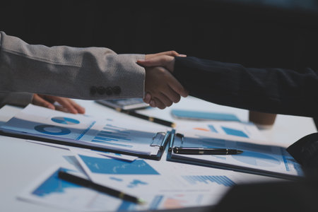 Business partnership meeting concept, Two confident Business handshake and business people after discussing good deal of Trading contract and new projects for both companies, success, partnership.の写真素材