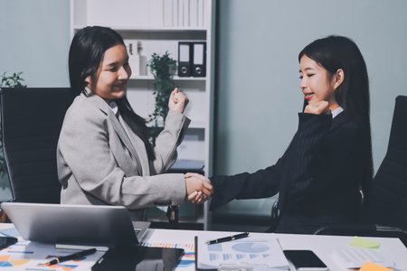 Accounting company provide finance and taxation planning for profitable cash flow, Auditor and accountant team working in office, analyze financial data and accounting record with calculator.Insightの写真素材