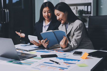 Accounting company provide finance and taxation planning for profitable cash flow, Auditor and accountant team working in office, analyze financial data and accounting record with calculator.Insightの写真素材