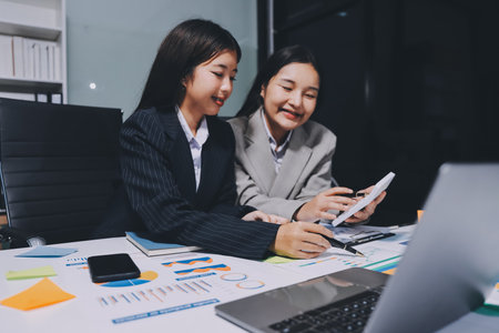 Accounting company provide finance and taxation planning for profitable cash flow, Auditor and accountant team working in office, analyze financial data and accounting record with calculator.Insightの写真素材