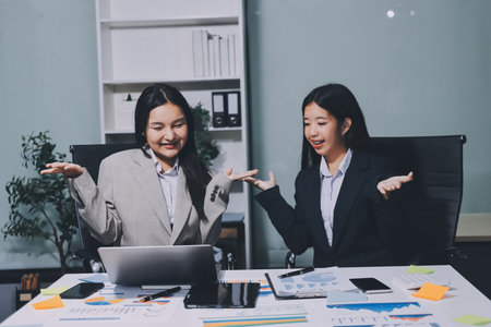 Accounting company provide finance and taxation planning for profitable cash flow, Auditor and accountant team working in office, analyze financial data and accounting record with calculator.Insightの写真素材