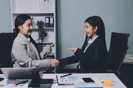 Accounting company provide finance and taxation planning for profitable cash flow, Auditor and accountant team working in office, analyze financial data and accounting record with calculator.Insightの写真素材