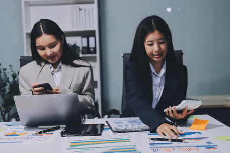 Accounting company provide finance and taxation planning for profitable cash flow, Auditor and accountant team working in office, analyze financial data and accounting record with calculator.Insightの写真素材