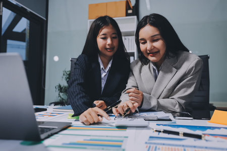Accounting company provide finance and taxation planning for profitable cash flow, Auditor and accountant team working in office, analyze financial data and accounting record with calculator.Insightの写真素材