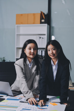 Accounting company provide finance and taxation planning for profitable cash flow, Auditor and accountant team working in office, analyze financial data and accounting record with calculator.Insightの写真素材