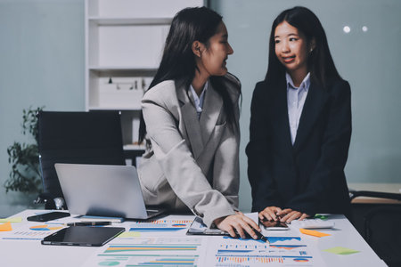 Accounting company provide finance and taxation planning for profitable cash flow, Auditor and accountant team working in office, analyze financial data and accounting record with calculator.Insightの写真素材