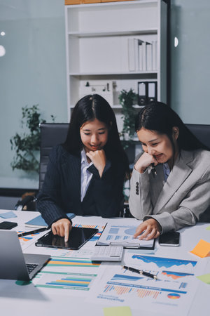 Accounting company provide finance and taxation planning for profitable cash flow, Auditor and accountant team working in office, analyze financial data and accounting record with calculator.Insightの写真素材