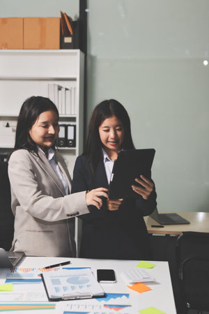 Accounting company provide finance and taxation planning for profitable cash flow, Auditor and accountant team working in office, analyze financial data and accounting record with calculator.Insightの写真素材