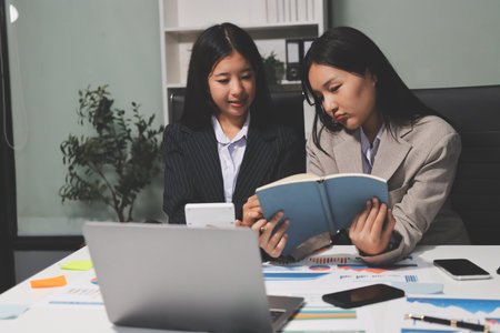 Accounting company provide finance and taxation planning for profitable cash flow, Auditor and accountant team working in office, analyze financial data and accounting record with calculator.Insightの写真素材