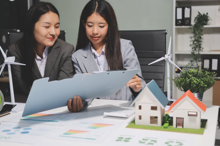 Business team people planning and discussing on recycle reduce reuse policy symbol in office meeting room.の写真素材