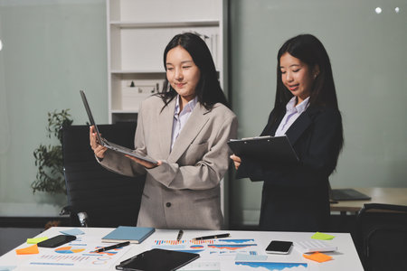 Accounting company provide finance and taxation planning for profitable cash flow, Auditor and accountant team working in office, analyze financial data and accounting record with calculator.Insightの写真素材