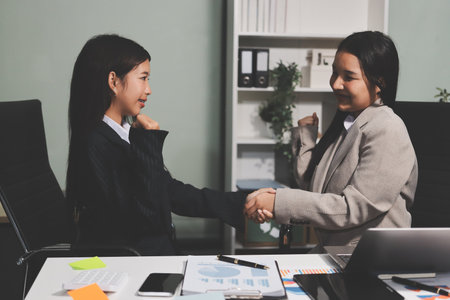 Accounting company provide finance and taxation planning for profitable cash flow, Auditor and accountant team working in office, analyze financial data and accounting record with calculator.Insightの写真素材