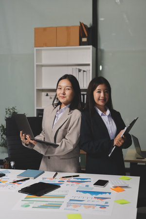 Accounting company provide finance and taxation planning for profitable cash flow, Auditor and accountant team working in office, analyze financial data and accounting record with calculator.Insightの写真素材