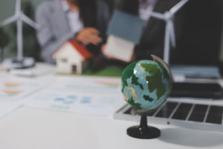 Business team people planning and discussing on recycle reduce reuse policy symbol in office meeting room.の写真素材