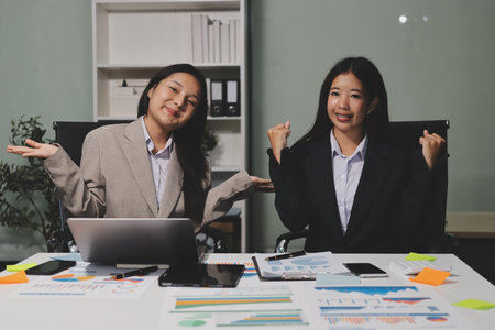 Accounting company provide finance and taxation planning for profitable cash flow, Auditor and accountant team working in office, analyze financial data and accounting record with calculator.Insightの写真素材