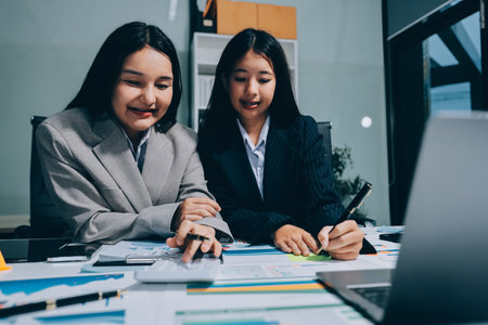 Accounting company provide finance and taxation planning for profitable cash flow, Auditor and accountant team working in office, analyze financial data and accounting record with calculator.Insightの写真素材