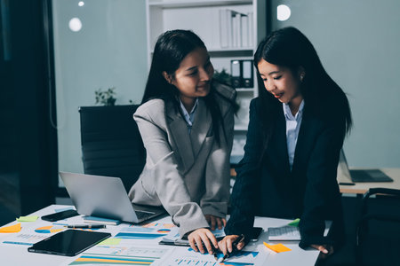 Accounting company provide finance and taxation planning for profitable cash flow, Auditor and accountant team working in office, analyze financial data and accounting record with calculator.Insightの写真素材