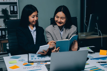 Accounting company provide finance and taxation planning for profitable cash flow, Auditor and accountant team working in office, analyze financial data and accounting record with calculator.Insightの写真素材