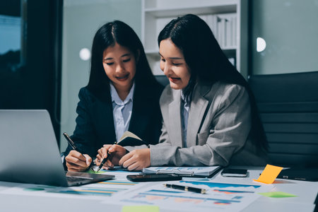 Accounting company provide finance and taxation planning for profitable cash flow, Auditor and accountant team working in office, analyze financial data and accounting record with calculator.Insightの写真素材