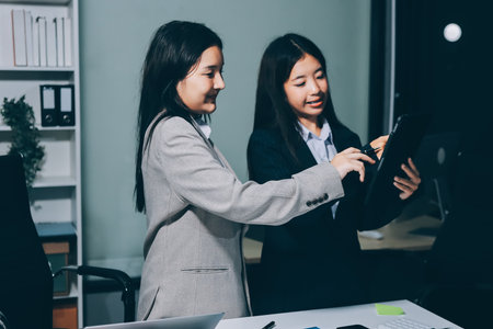 Accounting company provide finance and taxation planning for profitable cash flow, Auditor and accountant team working in office, analyze financial data and accounting record with calculator.Insightの写真素材