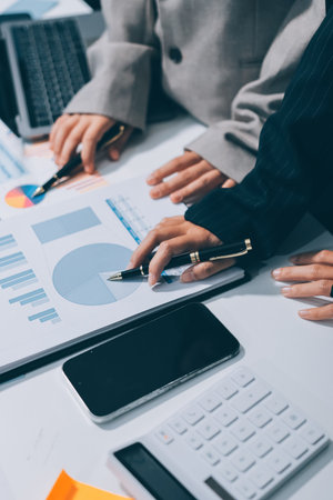 Accounting company provide finance and taxation planning for profitable cash flow, Auditor and accountant team working in office, analyze financial data and accounting record with calculator.Insightの写真素材