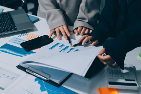 Accounting company provide finance and taxation planning for profitable cash flow, Auditor and accountant team working in office, analyze financial data and accounting record with calculator.Insightの写真素材