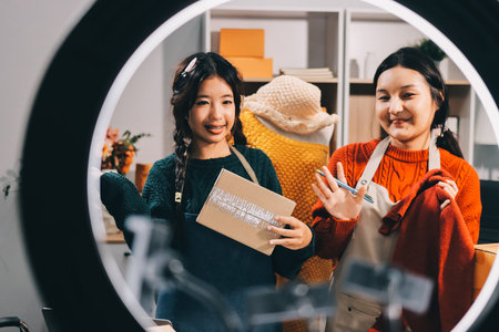 Portrait of Starting small businesses SME owners, two Asian woman check online orders Selling...