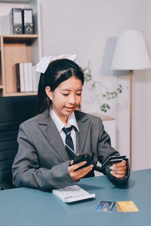 Close up woman hand using credit card and smartphone laptop for buying online shoppingの写真素材