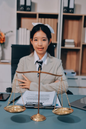 Judge gavel with Justice lawyers having team meeting at law firm background. Concepts of Law and Legal services.の写真素材