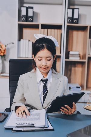 Judge gavel with Justice lawyers having team meeting at law firm background. Concepts of Law and Legal services.の写真素材