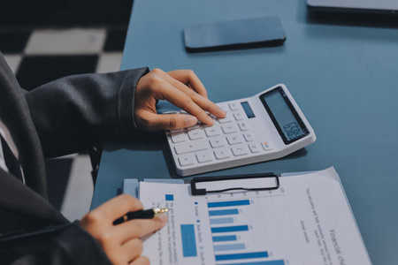 Business financing accounting banking concept. Business woman hand doing finances and calculate on...