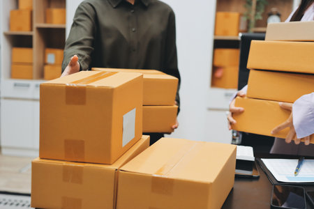 Portrait of Starting small businesses SME owners, two Asian woman check online orders Selling...