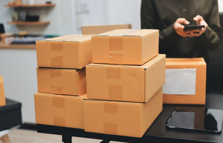 Portrait of Starting small businesses SME owners, two Asian woman check online orders Selling...