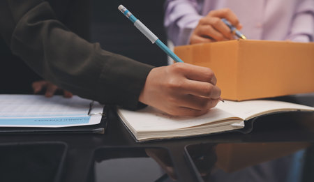 Portrait of Starting small businesses SME owners, two Asian woman check online orders Selling products working with boxs freelance work at home office, sme business online small medium enterpriseの写真素材