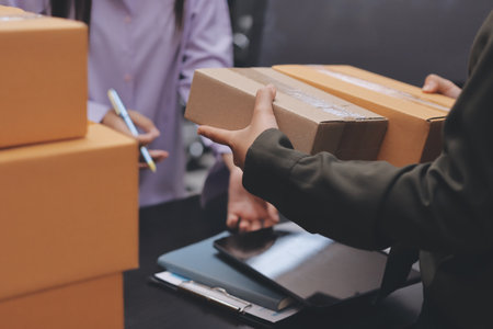 Portrait of Starting small businesses SME owners, two Asian woman check online orders Selling...