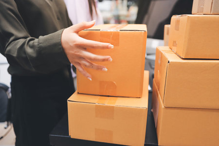 Portrait of Starting small businesses SME owners, two Asian woman check online orders Selling...