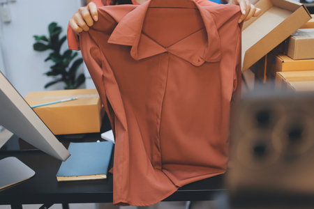 Portrait of Starting small businesses SME owners, two Asian woman check online orders Selling products working with boxs freelance work at home office, sme business online small medium enterpriseの写真素材