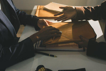 Lawyer explained to the client about the law that must be brought against the court case.の写真素材