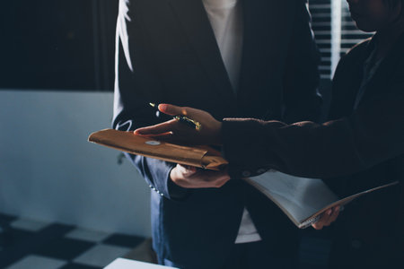 Lawyer explained to the client about the law that must be brought against the court case.の写真素材