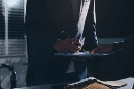 Lawyer explained to the client about the law that must be brought against the court case.の写真素材