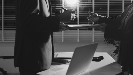 Lawyer explained to the client about the law that must be brought against the court case.の写真素材